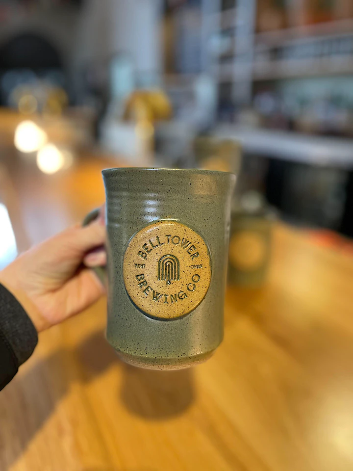 Example of craftsmanship of the mug. Color changes each year. Green mug in the picture is from the first year.